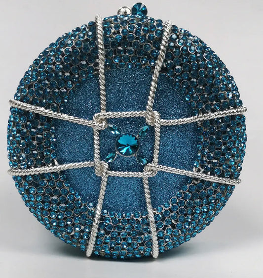 Bolso de fiesta redondo con diamantes color azul.