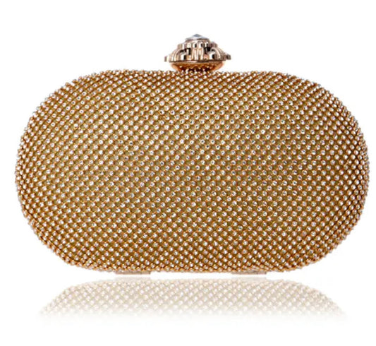 Bolso/Clutch color dorado con red de pedrería.