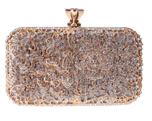 Bolso de mano con diseño floral con base plata y oro rosado.