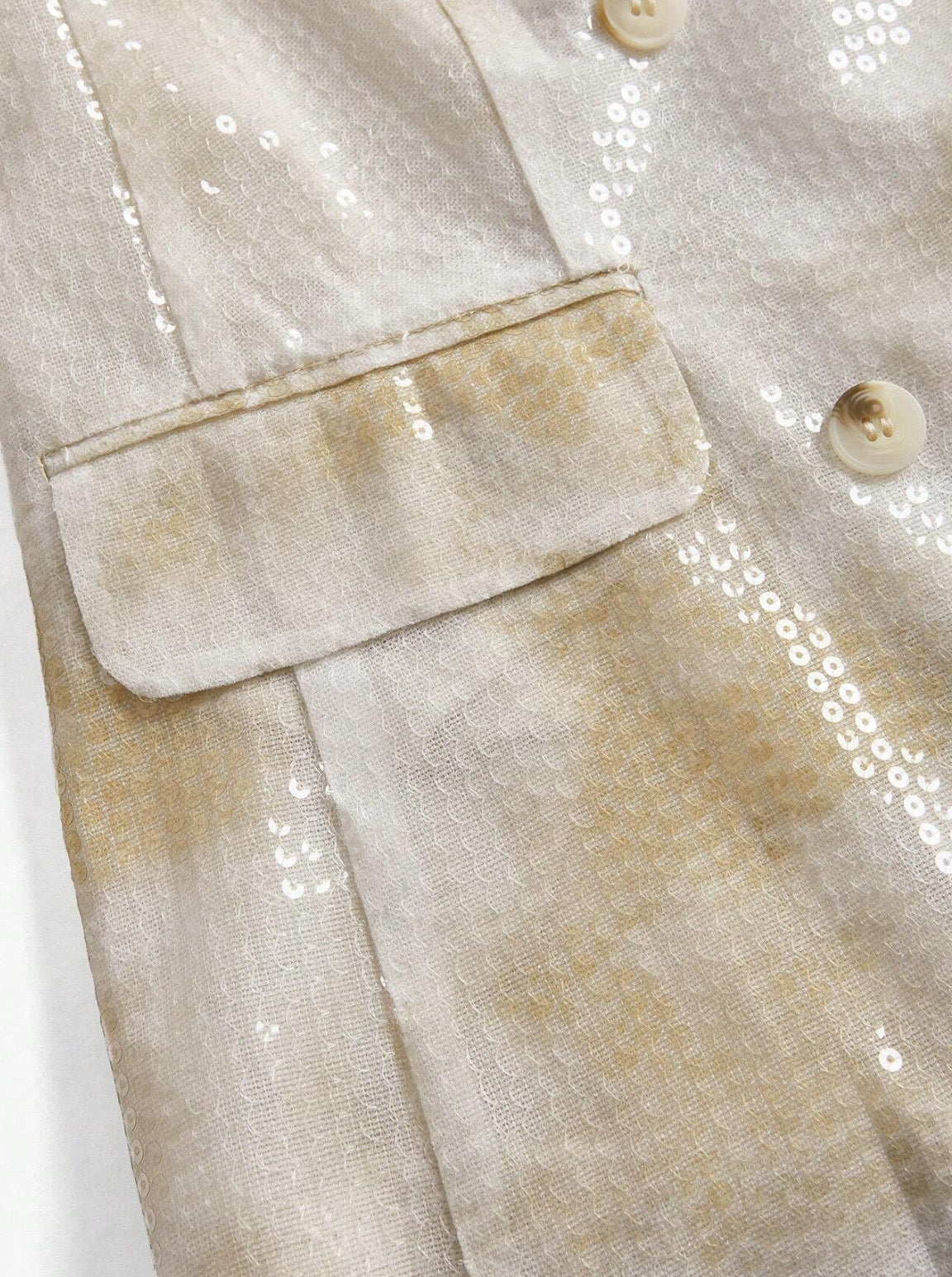 Blazer lentejuela tonos pasteles.