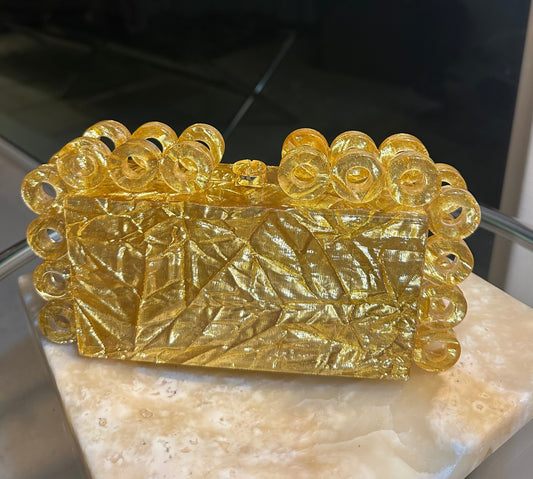 Bolso de mano de acrílico para mujer color dorado